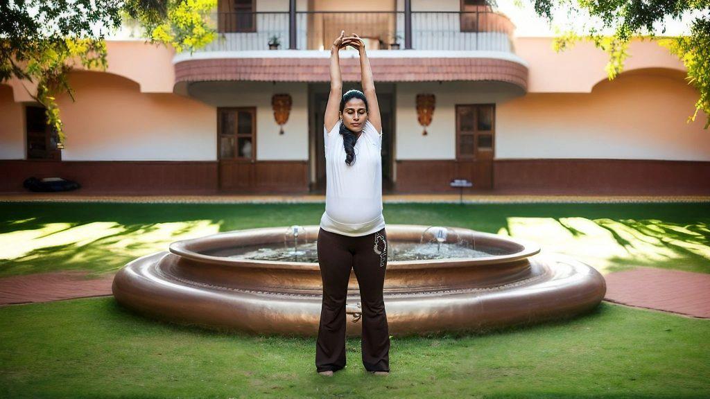 Yoga Tadasana - a lady standing straight with raised hands in tadasana yoga pose