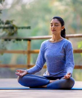 benefits of meditation - girl meditating at blr ashram