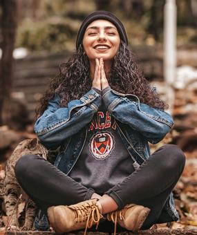 smiling-girl-sitting-with-cat-with-eyes-closed